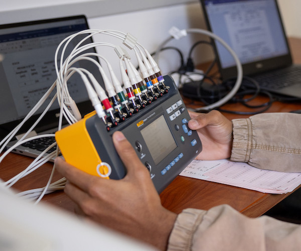 Image of medical equipment in a student's hands.